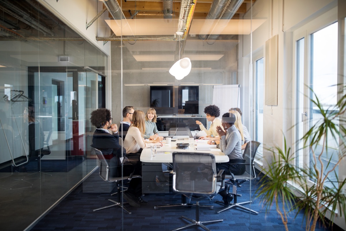 Colleagues collaborating in a secure quality workspace